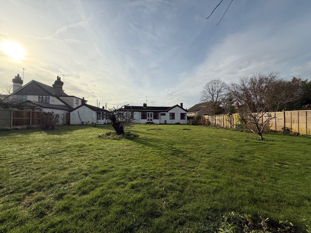 Lot: 155 - DETACHED BUNGALOW FOR IMPROVEMENT IN POPULAR LOCATION - Rear view of the property and gardens